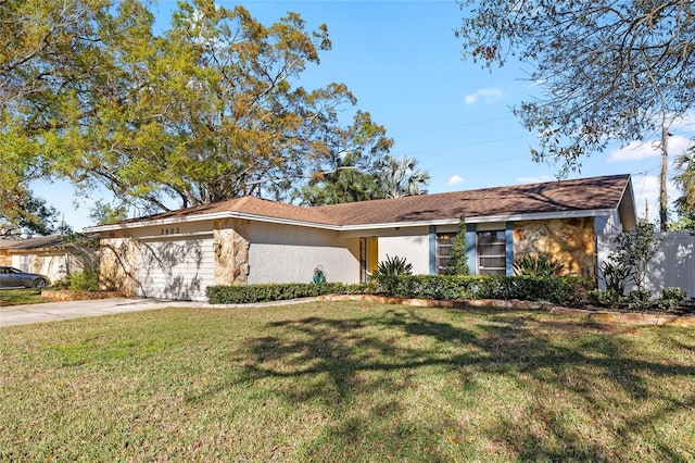 view of front of home featuring an attached garage, driveway, stone siding, stucco siding, and a front lawn