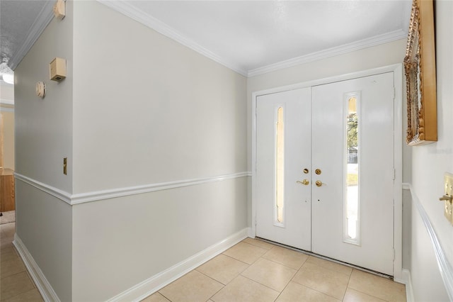 foyer entrance featuring ornamental molding and a healthy amount of sunlight