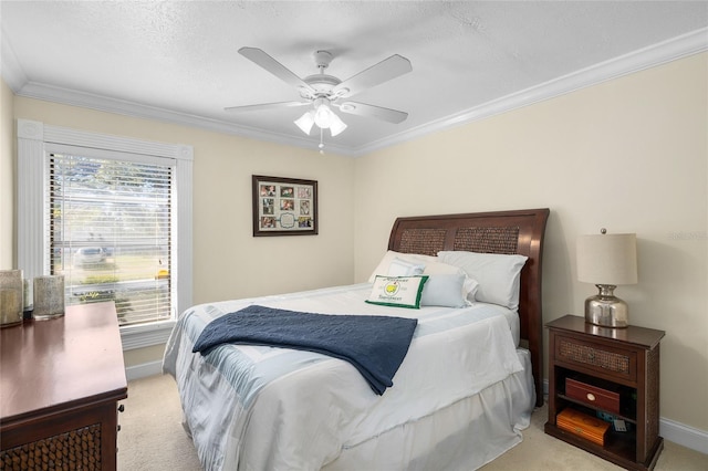 bedroom with light carpet, ceiling fan, baseboards, and crown molding