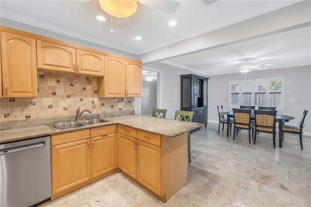 kitchen featuring a ceiling fan, a peninsula, a sink, dishwasher, and backsplash