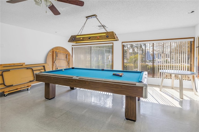 recreation room featuring visible vents, a textured ceiling, ceiling fan, and billiards