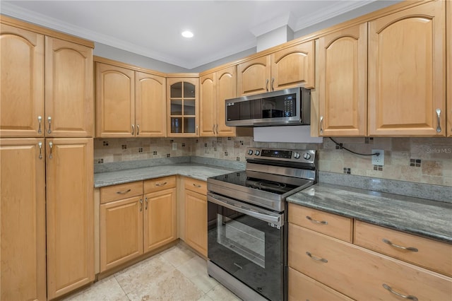 kitchen featuring stainless steel appliances, glass insert cabinets, decorative backsplash, and light brown cabinetry