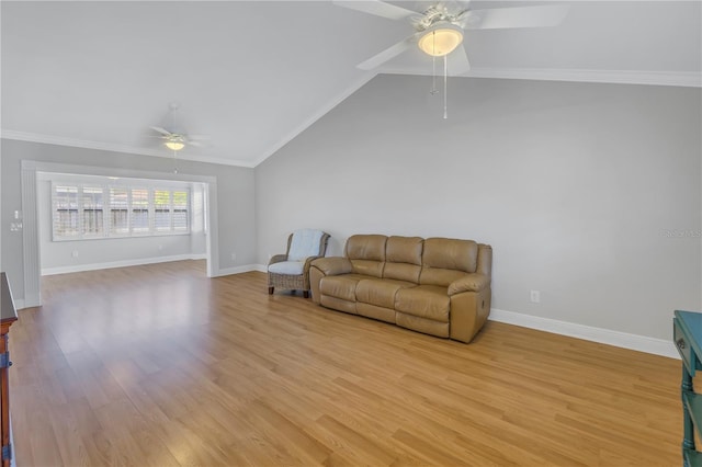 living area featuring light wood-type flooring, lofted ceiling, ceiling fan, and crown molding