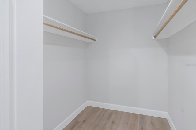 spacious closet with wood finished floors