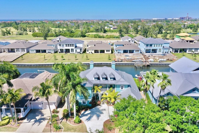 birds eye view of property with a residential view and a water view