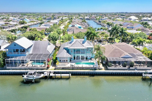 aerial view with a residential view and a water view