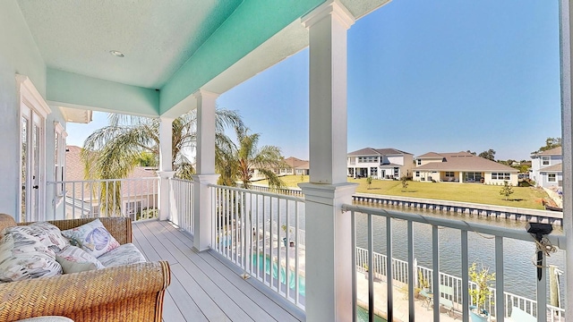 balcony with a water view and a residential view