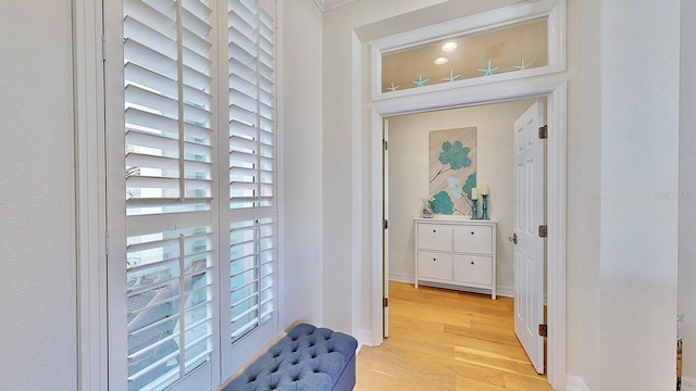 interior space with light wood-style flooring and baseboards