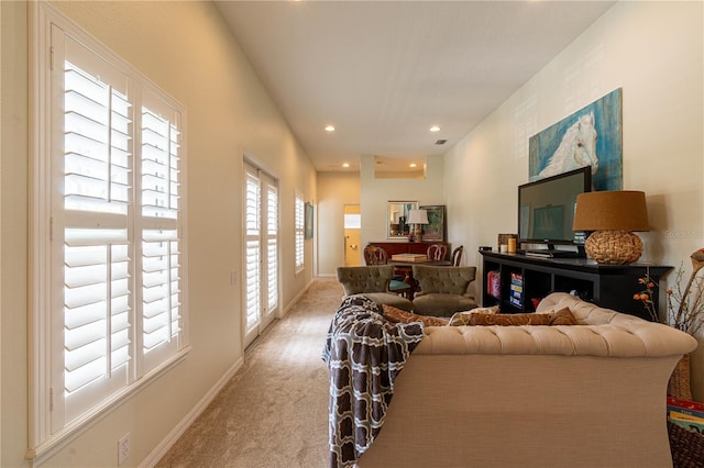 living area with recessed lighting, carpet flooring, and baseboards