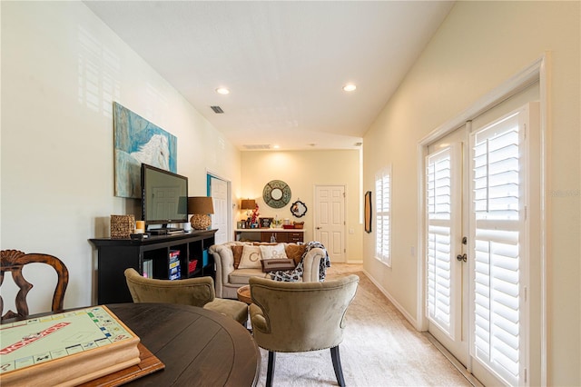 living room featuring light carpet, baseboards, visible vents, and recessed lighting