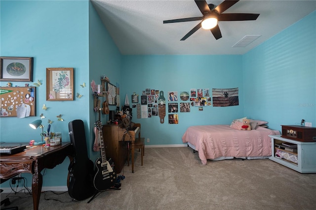 carpeted bedroom featuring a ceiling fan, visible vents, and baseboards