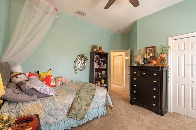 bedroom with carpet floors, lofted ceiling, visible vents, and ceiling fan