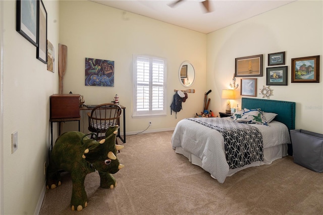 carpeted bedroom featuring a ceiling fan and baseboards