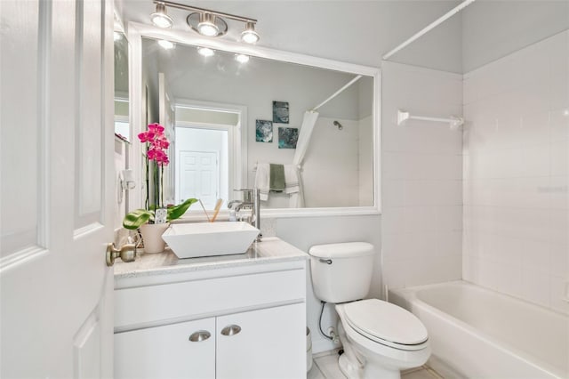 full bathroom featuring bathtub / shower combination, vanity, and toilet