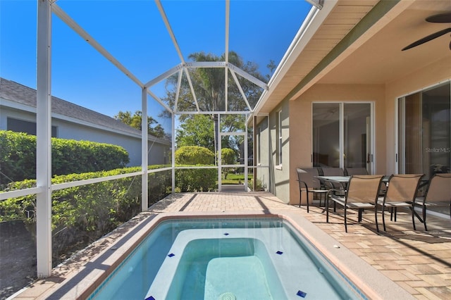 view of swimming pool with a lanai and a patio area