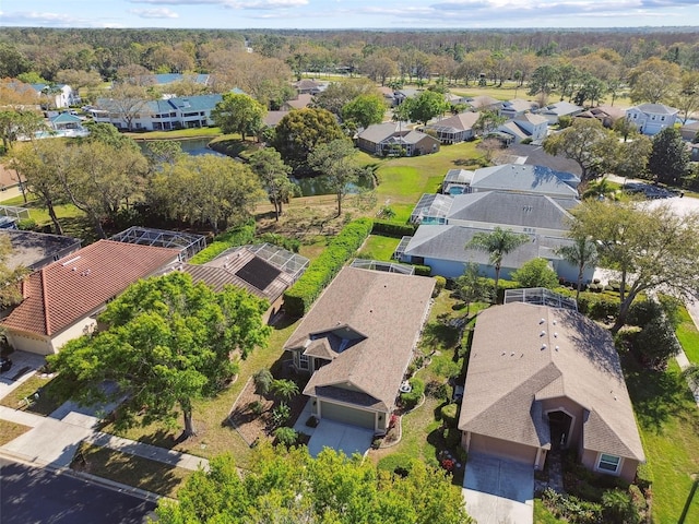 birds eye view of property featuring a water view and a residential view