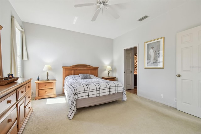 bedroom featuring light carpet, baseboards, visible vents, and ceiling fan