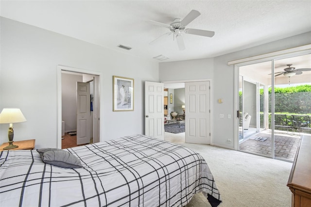 bedroom featuring access to exterior, carpet floors, a textured ceiling, visible vents, and ceiling fan