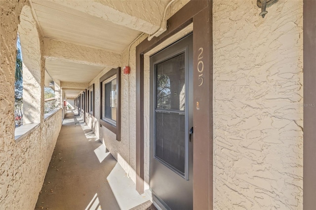 entrance to property with stucco siding