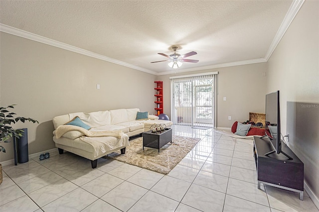 living room featuring light tile patterned floors, ornamental molding, ceiling fan, a textured ceiling, and baseboards