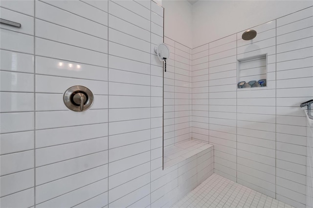 full bathroom with tiled shower