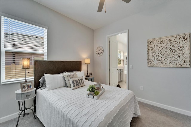 bedroom featuring ceiling fan, baseboards, carpet flooring, and ensuite bathroom