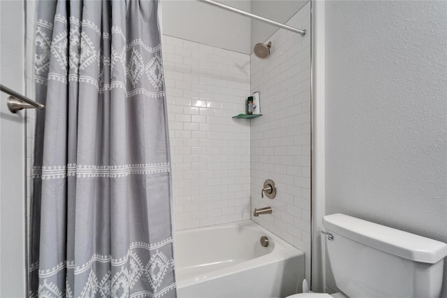 full bath with shower / tub combo, a textured wall, and toilet