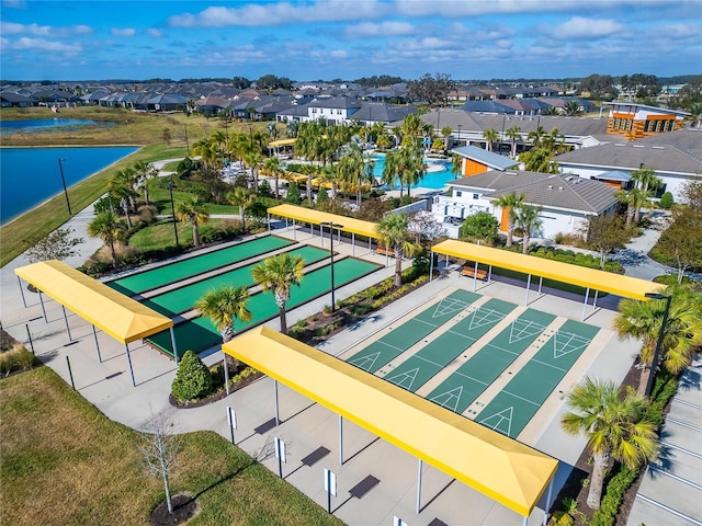birds eye view of property with a water view and a residential view