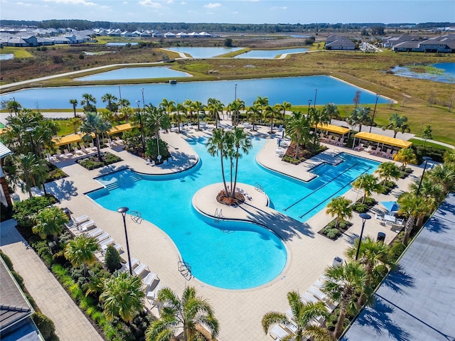 view of swimming pool with a water view
