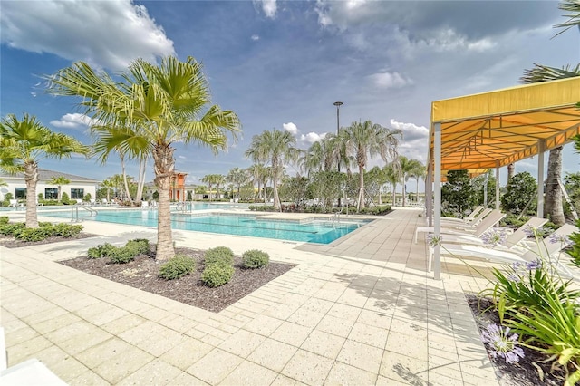 community pool with a patio area