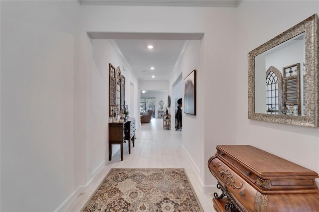 hallway featuring ornamental molding, recessed lighting, and baseboards