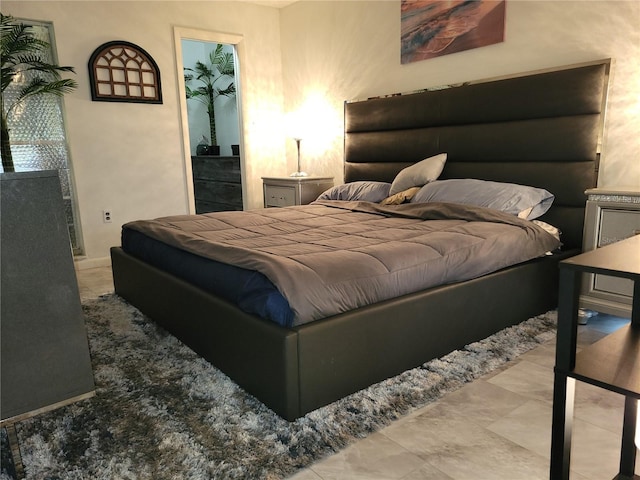 bedroom featuring a walk in closet and a closet