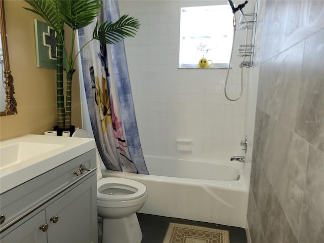 bathroom featuring shower / tub combo with curtain, vanity, and toilet