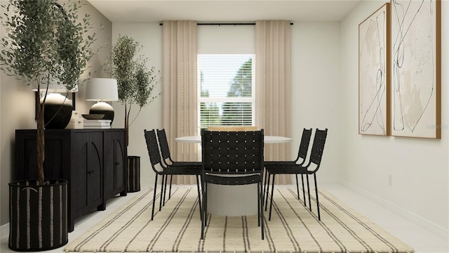 dining room featuring baseboards