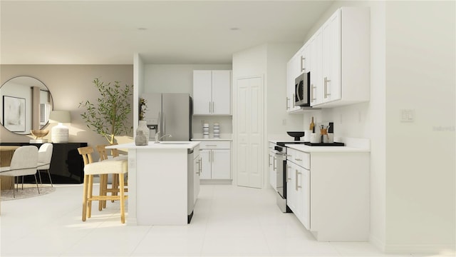 kitchen featuring stainless steel appliances, a breakfast bar area, light countertops, and white cabinets