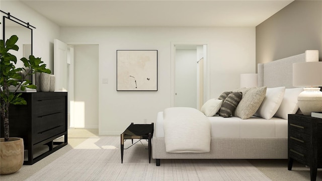 bedroom featuring light carpet, baseboards, and a barn door