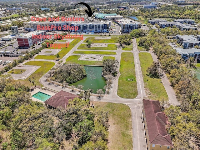 birds eye view of property with a water view