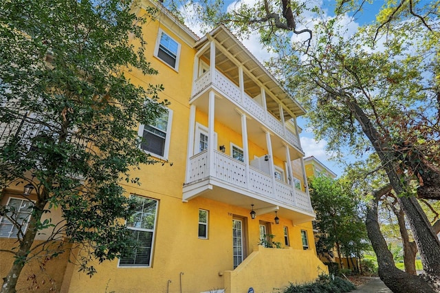 view of side of home with stucco siding