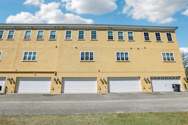 view of building exterior featuring an attached garage