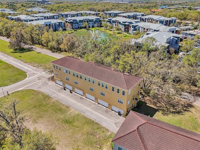 birds eye view of property with a residential view