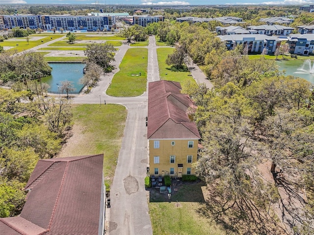 birds eye view of property featuring a water view