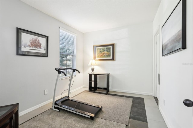 workout area with tile patterned floors and baseboards