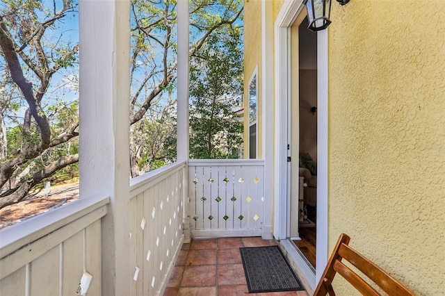 exterior space featuring stucco siding and a balcony