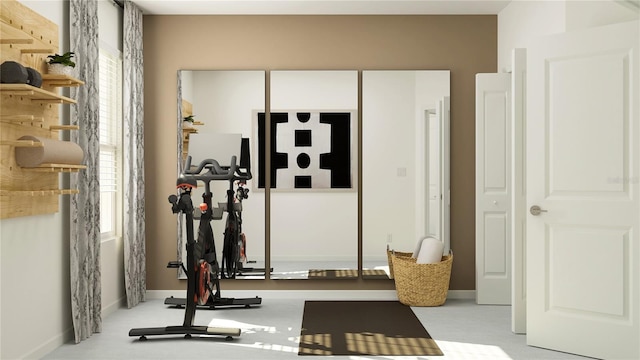 exercise room with baseboards