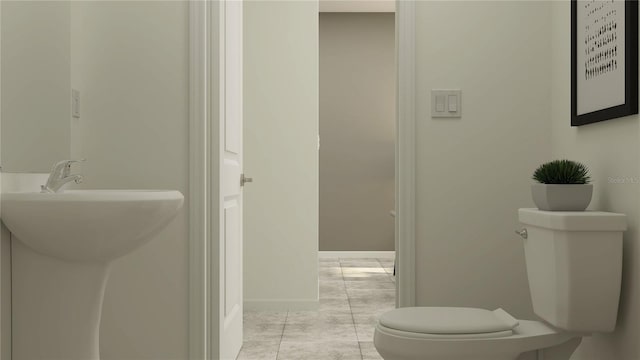 bathroom with toilet and baseboards