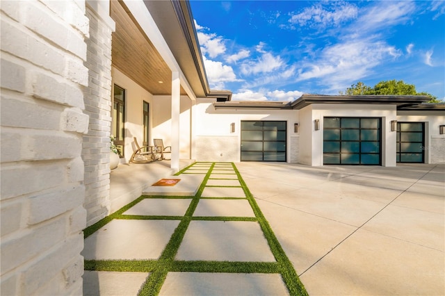 exterior space with an attached garage and concrete driveway