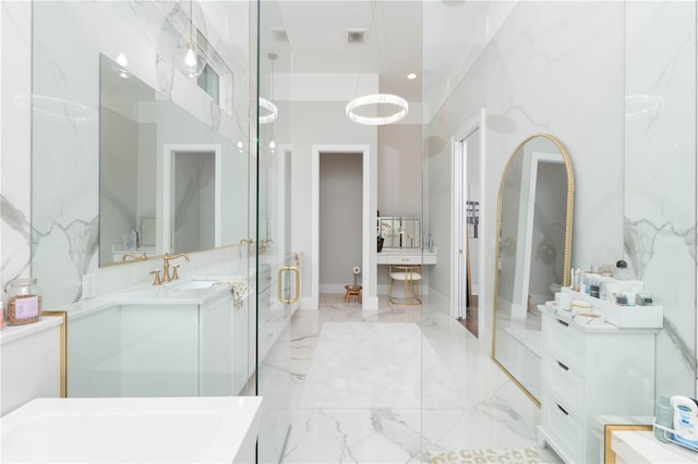 bathroom featuring marble finish floor, vanity, and recessed lighting