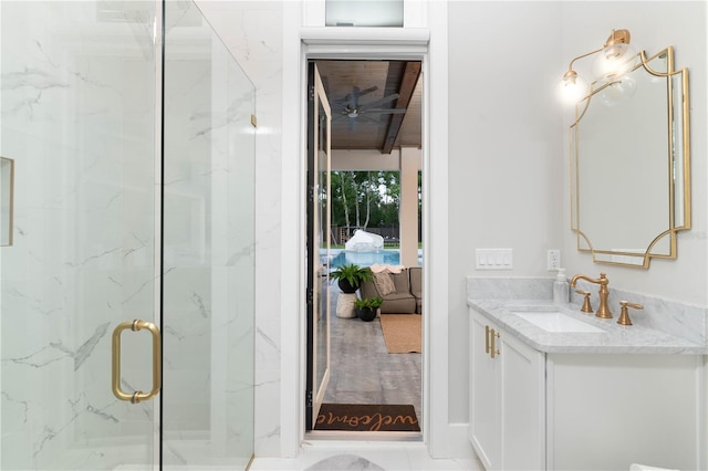 ensuite bathroom featuring ensuite bath, a marble finish shower, and vanity