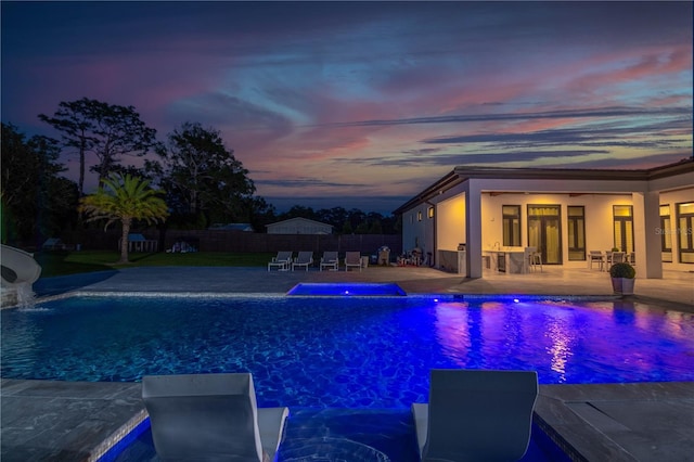 view of swimming pool with a fenced in pool, a patio, and fence