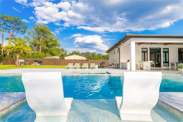 view of swimming pool with ceiling fan, fence private yard, a diving board, a fenced in pool, and a patio area